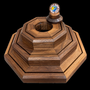 Actual finished BraveCraft three-tier walnut display on black, holder removed. Chamfered edges and recessed coin grooves. Coins not included.