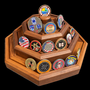 Actual finished BraveCraft three-tier walnut display on black, with coins. Chamfered edges and recessed coin grooves. Coins not included.